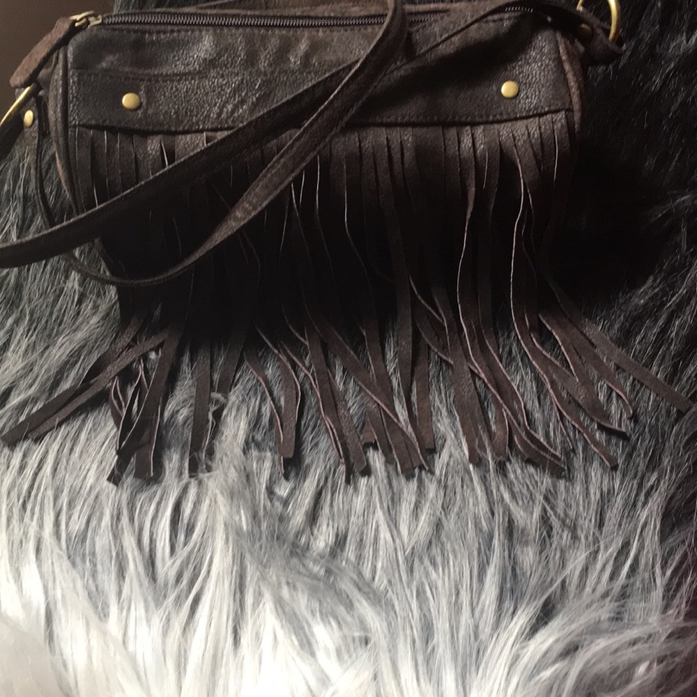 Wilson’s leather tootsie roll fringe purse